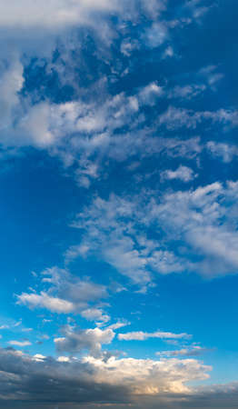 Fantastic clouds at sunrise, vertical panoramaの写真素材