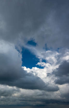 Fantastic soft thunderclouds, natural sky composition, vertical panoramaの写真素材