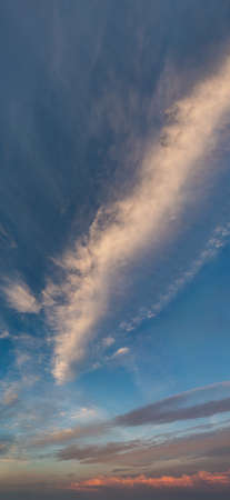 Fantastic clouds at sunrise, vertical panoramaの写真素材