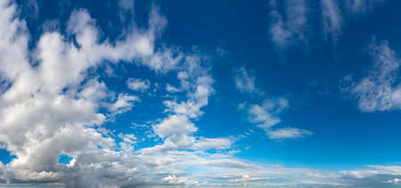 Fantastic clouds against blue sky, panoramaの写真素材