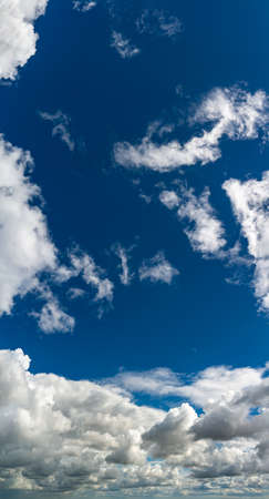 Fantastic clouds against blue sky, panoramaの写真素材