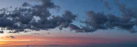 Fantastic thunderclouds at sunriseの写真素材