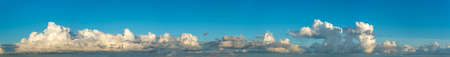 Fantastic clouds against blue sky, panoramaの写真素材