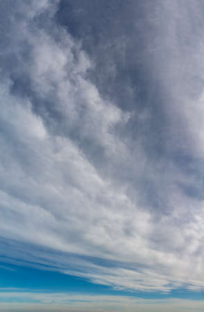 Fantastic soft thunderclouds, natural sky composition, vertical panoramaの写真素材