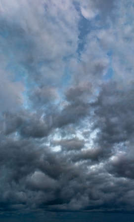 Fantastic soft thunderclouds, natural sky composition, vertical panoramaの写真素材
