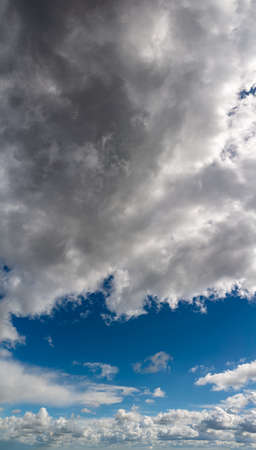 Fantastic soft thunderclouds, natural sky composition, vertical panoramaの写真素材