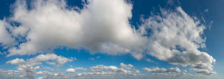 Fantastic soft clouds against blue sky, natural composition - panoramaの写真素材