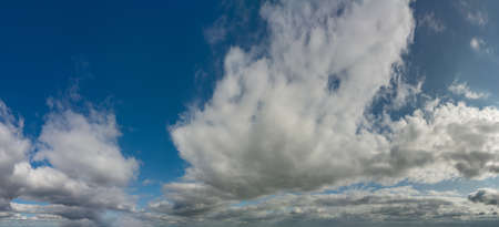 Fantastic soft clouds against blue sky, natural composition - panoramaの写真素材