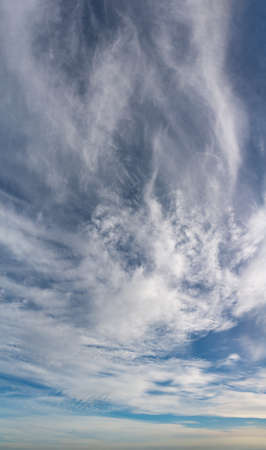 Fantastic soft thunderclouds, natural sky composition, vertical panoramaの写真素材