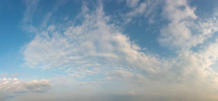 Fantastic soft clouds against blue sky, natural composition - panoramaの写真素材