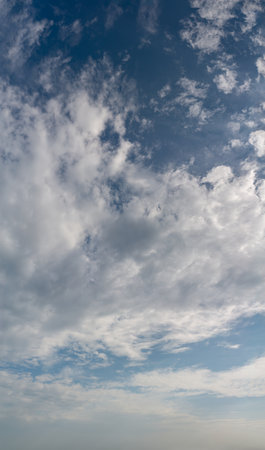 Fantastic soft thunderclouds, natural sky composition, vertical panoramaの写真素材