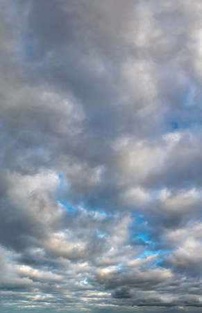 Fantastic soft thunderclouds, natural sky composition, vertical panoramaの写真素材