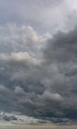 Fantastic soft thunderclouds, natural sky composition, vertical panoramaの写真素材