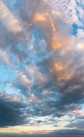 Fantastic clouds at sunrise, vertical panoramaの写真素材