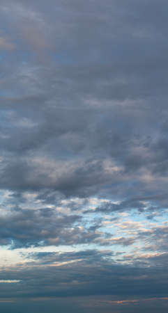 Fantastic soft thunderclouds, natural sky composition, vertical panoramaの写真素材