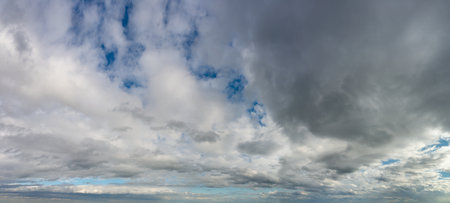 Fantastic soft thunderclouds, natural sky composition, wide panoramaの写真素材