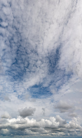 Fantastic clouds against blue sky, panorama