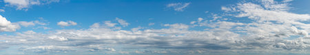 Fantastic clouds against blue sky, panoramaの写真素材
