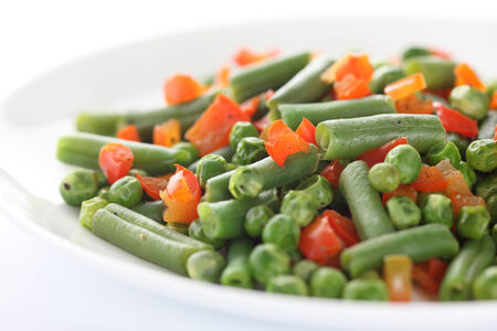 Vegan salad. Ingredients: string beans, green peas, red bell pepper. Close-up.の写真素材