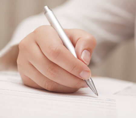 Businesswoman signing contract.の写真素材