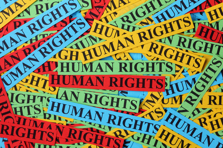 Pile of colorful paper notes with words Human Rights.Human rights concept.
