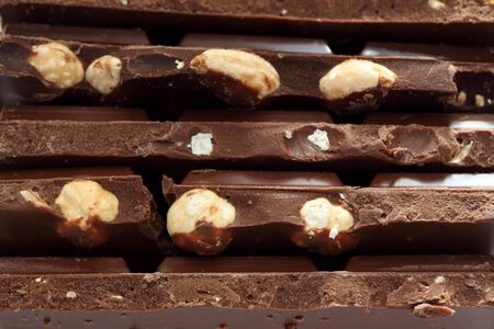 Chocolate with nuts. Close-up.