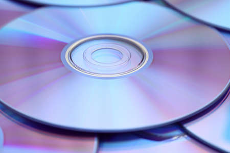 DVDs background. Shallow depth of field. Close-up.