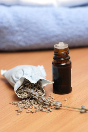 Bag of lavender and oil bottle close-up.の写真素材