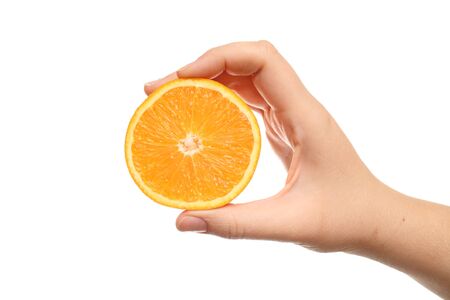 Orange in hand against white background. Close-up.の写真素材