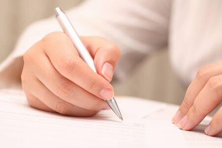 Businesswoman signing the contractの写真素材