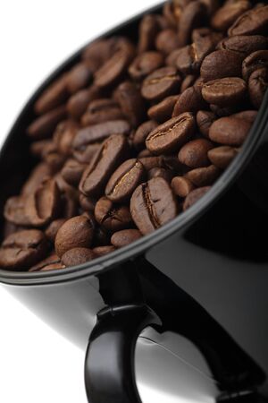 Black cup of coffee beans. Close-up.の写真素材