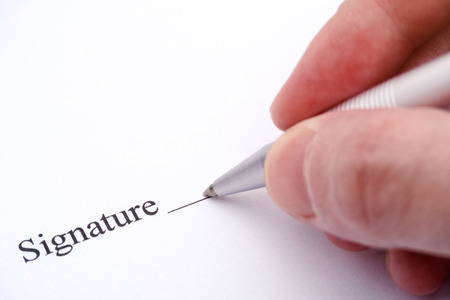 Contract ready for signature. Businessman signing contract.