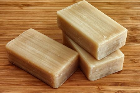 Three eco soap bars on a wooden background.の写真素材
