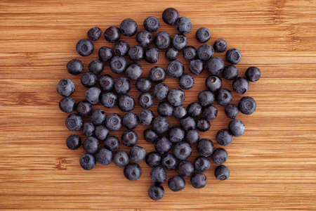 Blueberries on a wooden background. Close up.