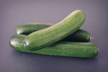 Fresh cucumbers on a grey background. Close up.の写真素材