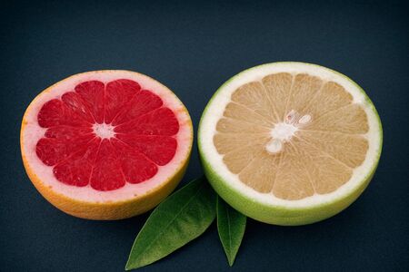 Two half of red and white grapefruits. Close up.の写真素材