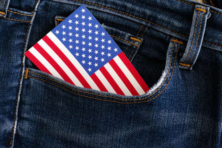 American flag in a pocket of blue jeans. Close up.の写真素材
