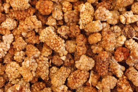 Sun dried white mulberries background. Close up.の写真素材
