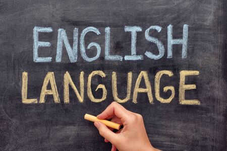 English language. Hand drawing English Language on blackboard. Close up.の写真素材
