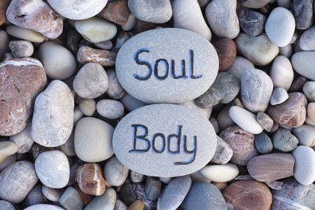 Words Body and Soul written on stones. Close up.の写真素材