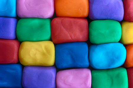 Colorful blocks made out of plasticine. Plasticine wall. Close up.の写真素材