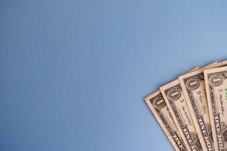 US dollar bills. Blue background.の写真素材