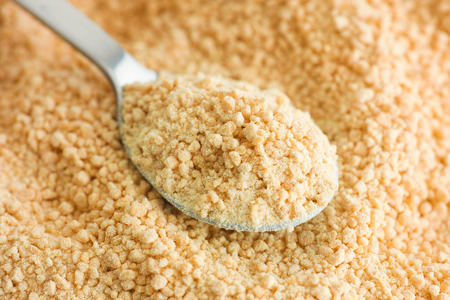 Soy lecithin in a tea spoon. Close up.の写真素材