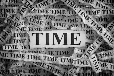 Time. Torn pieces of paper with the words Time. Concept Image. Black and White. Closeup.の写真素材