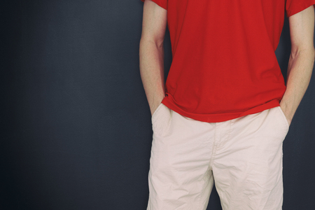 Man holding both hands in his pockets. Close up.の写真素材