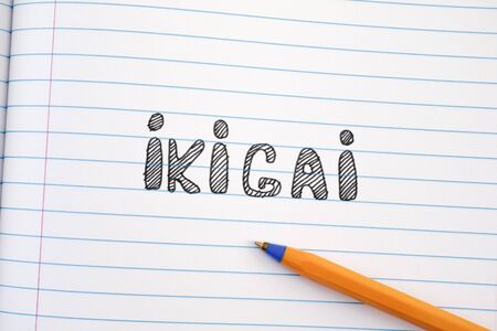 The word Ikigai on notebook sheet and pen. IKIGAI is a Japanese concept reason for being.の写真素材