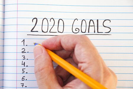 2020 goals list on notebook sheet. Close up.