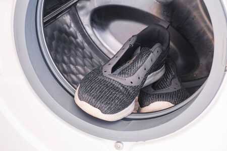 Sneakers inside the washing machineの写真素材