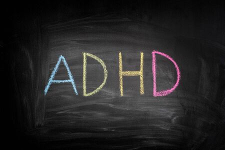 ADHD. Abbreviation ADHD on a blackboard. ADHD is Attention deficit hyperactivity disorder.の写真素材