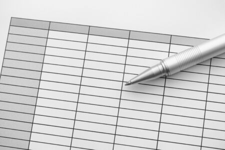 Empty spreadsheet and ballpoint pen. Black and White. Close up.の写真素材